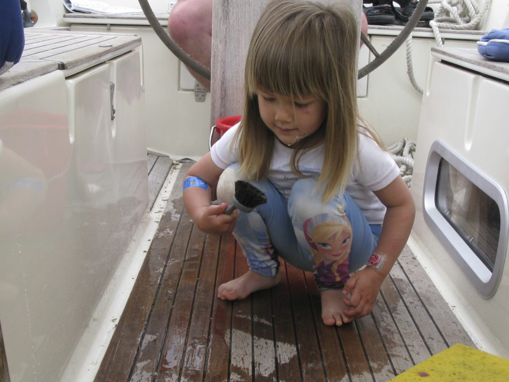 Ronja grandchild cleaning boat